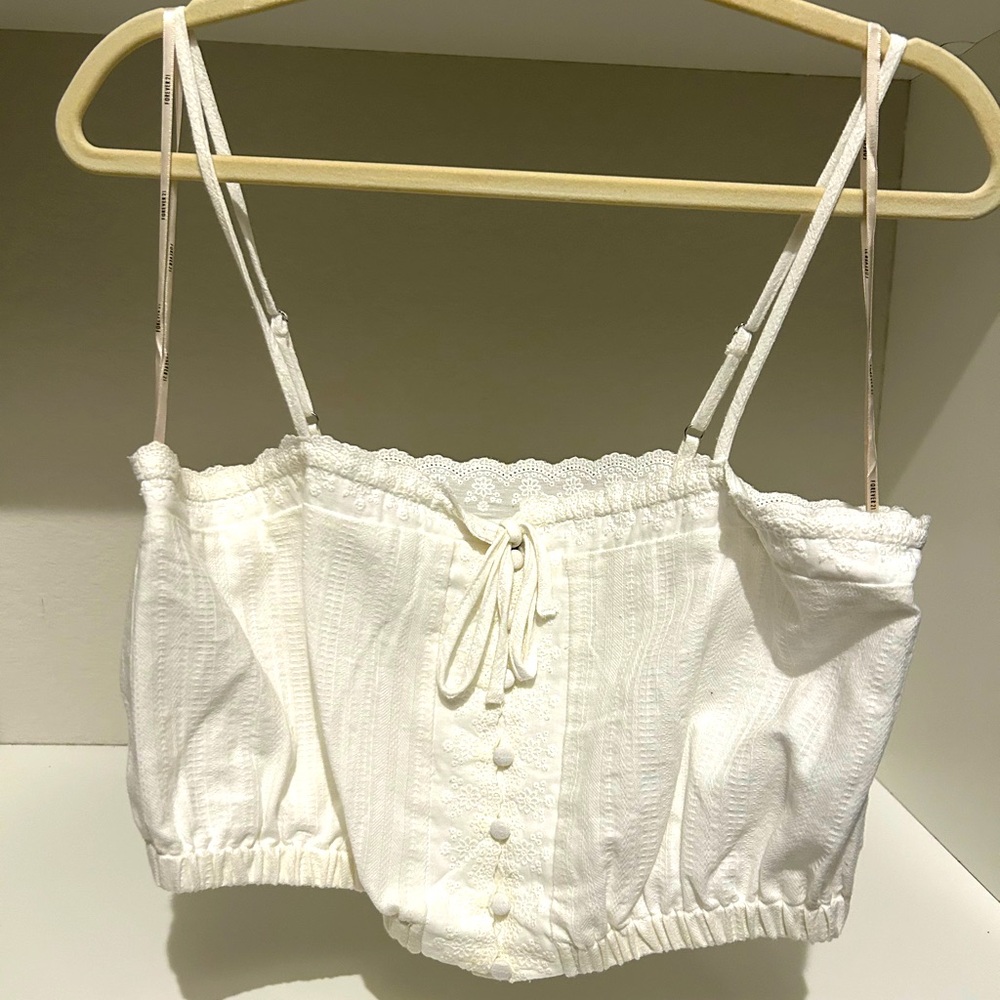 Forever 21 eyelet top. Button detailing. Size large. Tried on but never worn.